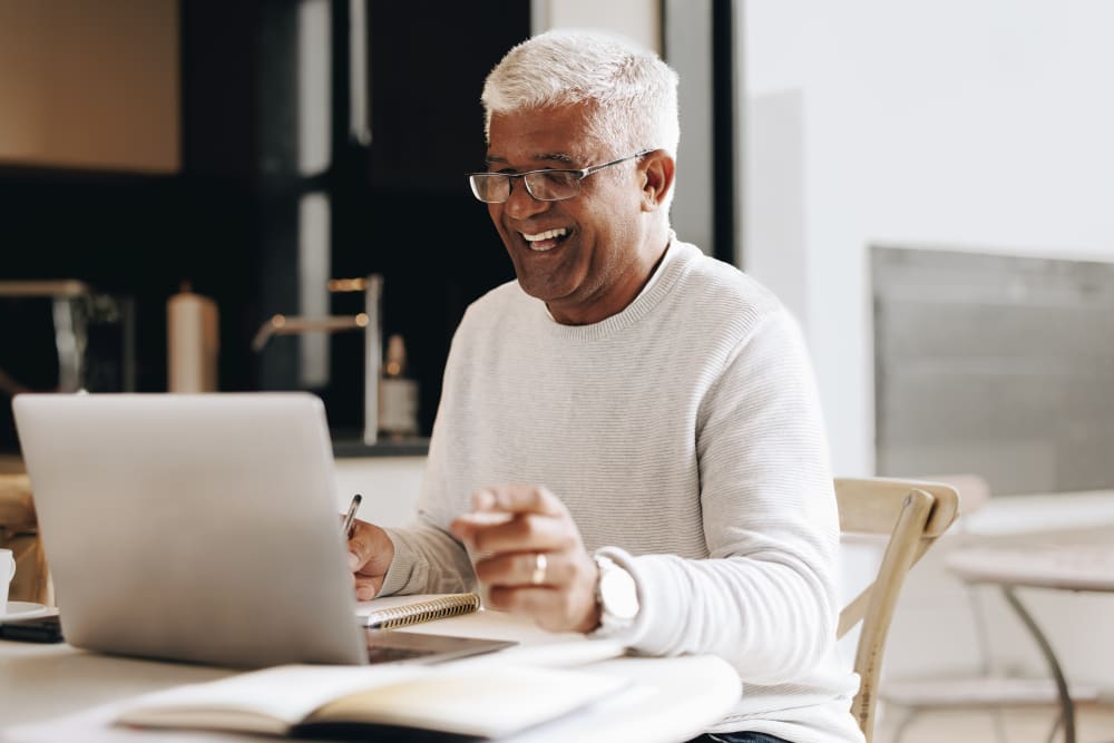 Businessman working from home at desk with proper ergonomic setup